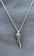 Wire wrapped steel "unicorn horn" necklace